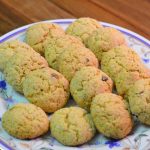 Moroccan semolina cookies called harcha dyal ferran sit on a serving plate.