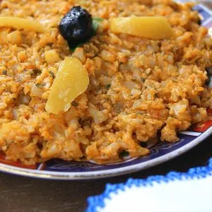 overhead view of a dish of cauliflower mashed and mixed with chermoula.