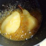 Simmering and caramelizing pears in a saucepan